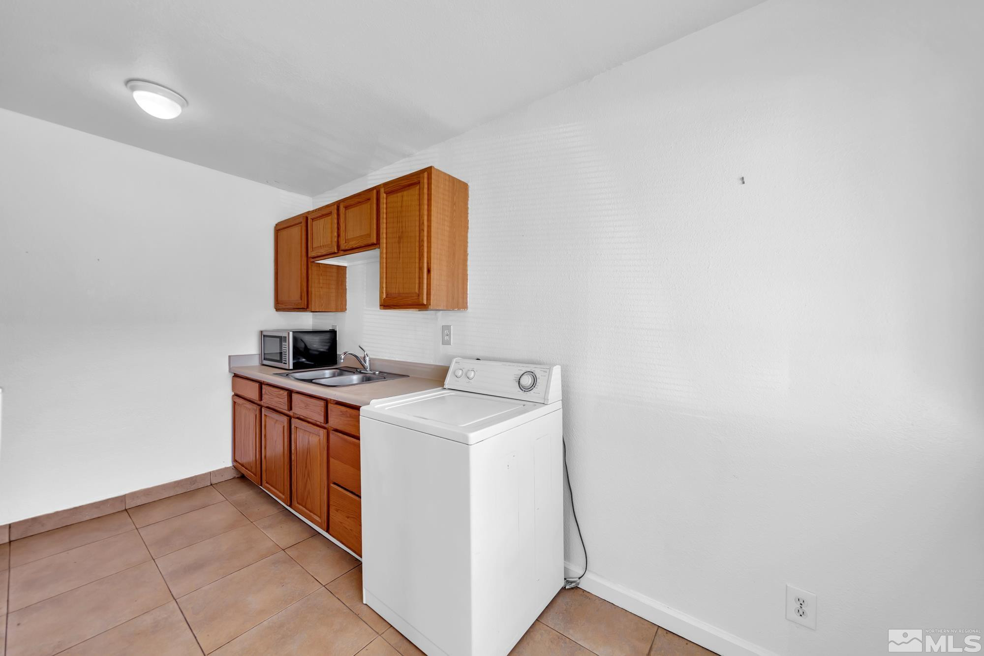 2365 Patton Drive Reno, NV 89512 - Photo 5 of 20 a utility room with dryer and washer