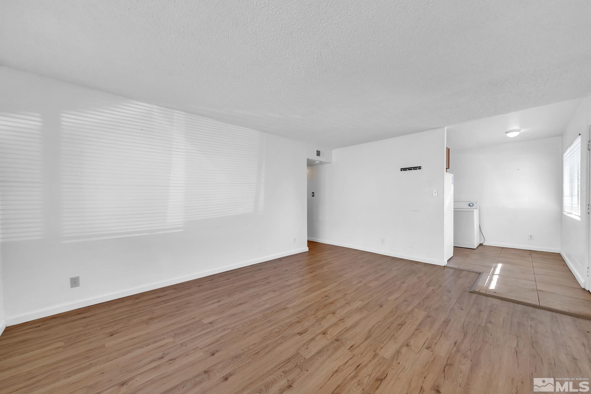 2365 Patton Drive Reno, NV 89512 - Photo 8 of 20 a view of an empty room with wooden floor
