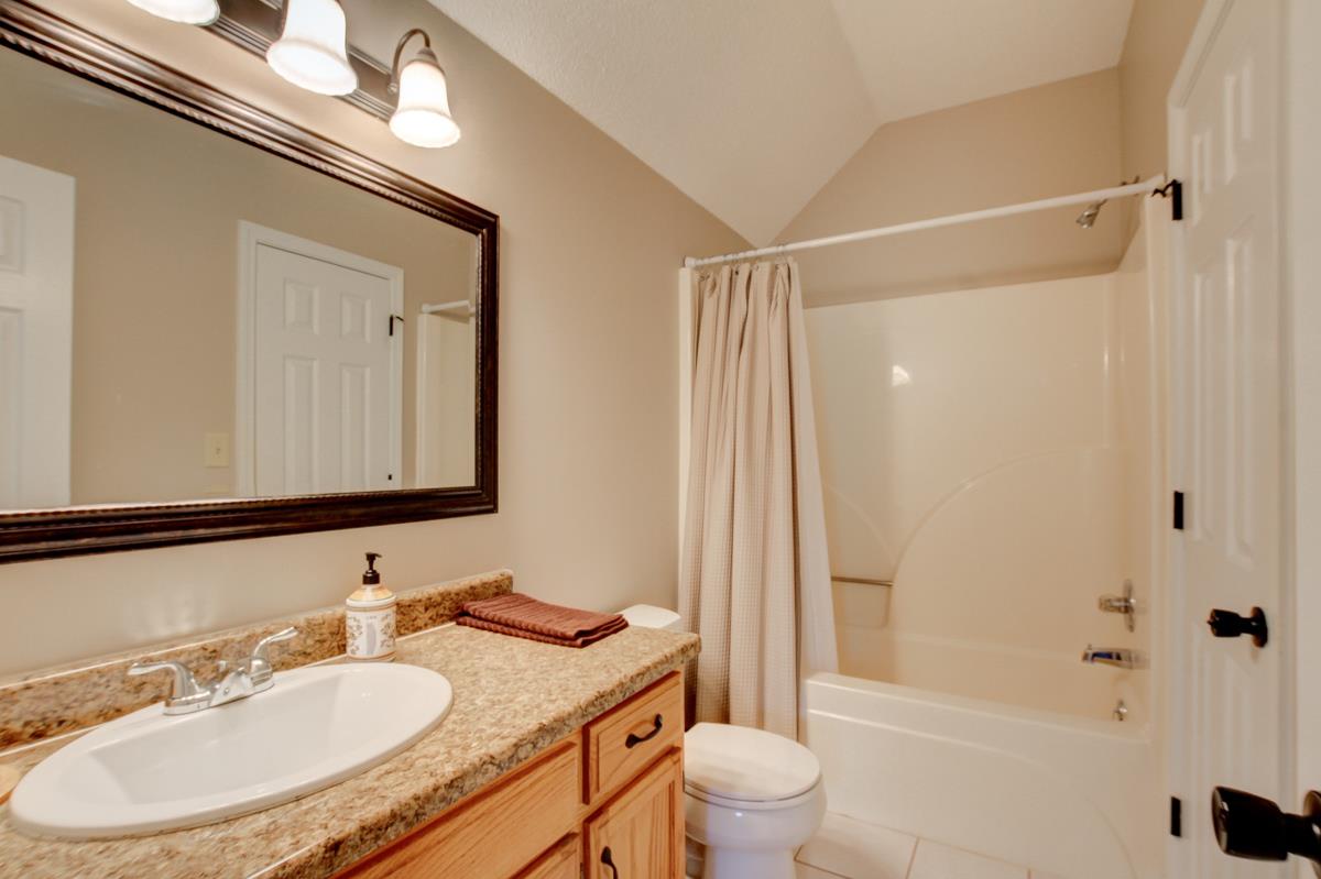 730 Dixie Bee Road Clarksville, TN 37043 - Photo 23 of 30 a bathroom with a granite countertop sink toilet and shower