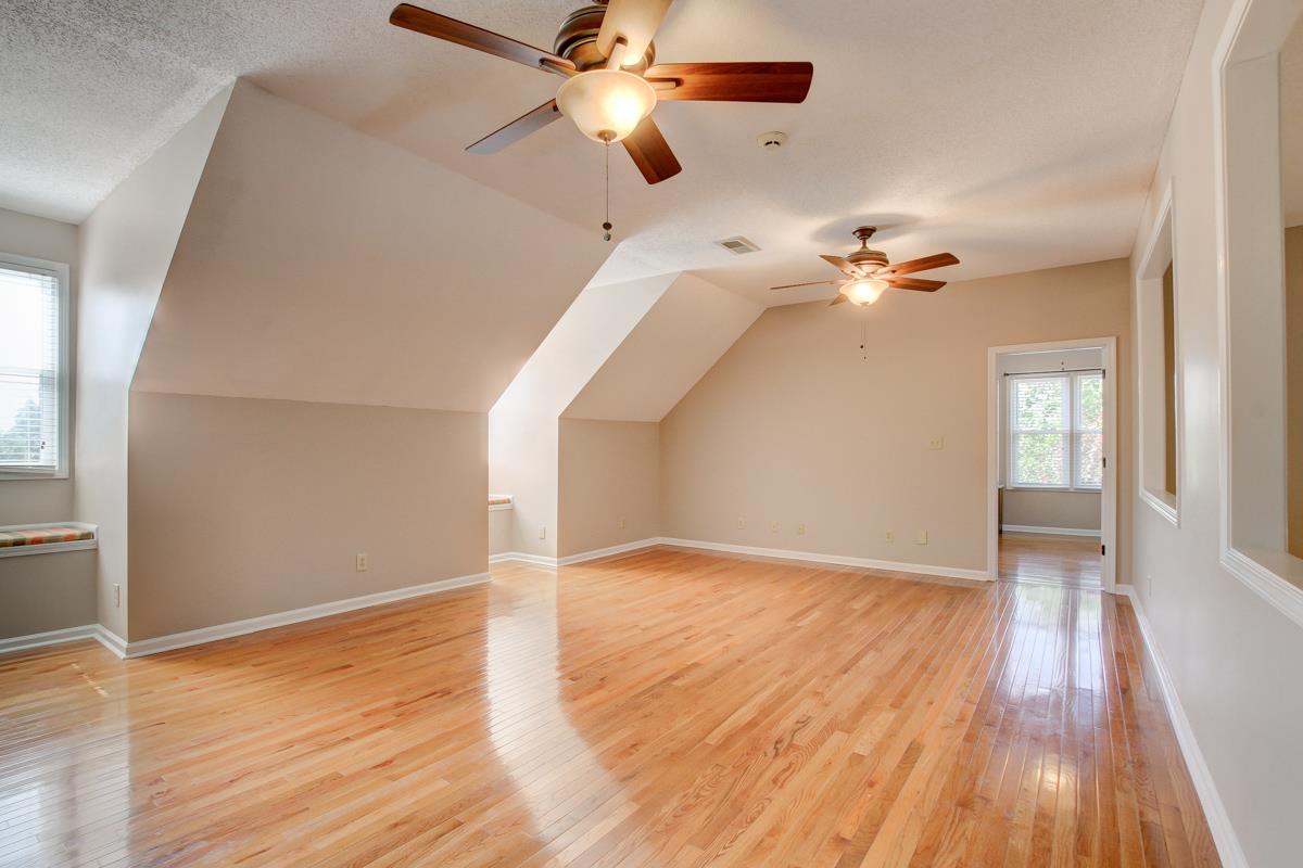 730 Dixie Bee Road Clarksville, TN 37043 - Photo 24 of 30 an empty room with wooden floor fan and windows