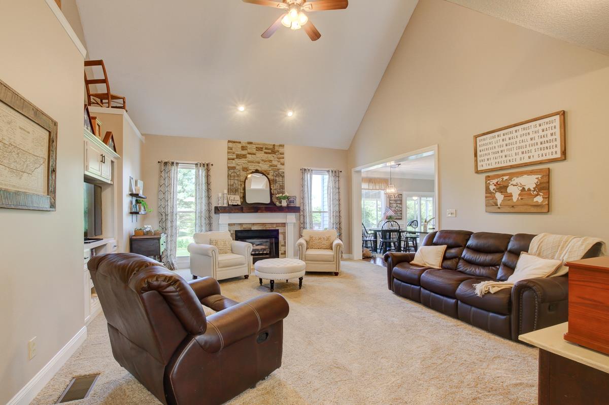 730 Dixie Bee Road Clarksville, TN 37043 - Photo 6 of 30 a living room with furniture ceiling fan and a fireplace