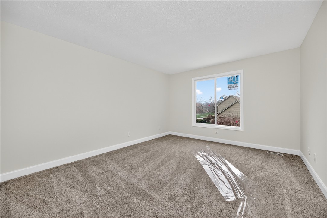 811 Wind Bluff Point Springboro, OH 45066 - Photo 26 of 51 This spacious room provides a serene retreat with soft carpeting and natural light.
