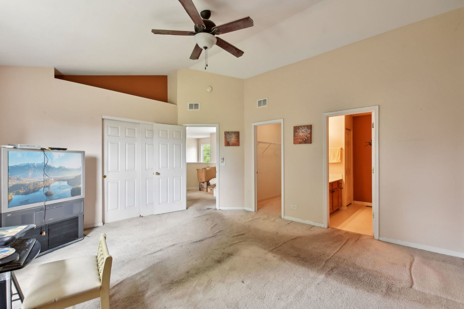 2673 Rourke Drive Aurora, IL 60503 - Photo 16 of 37 a view of a livingroom with a ceiling fan & entryway