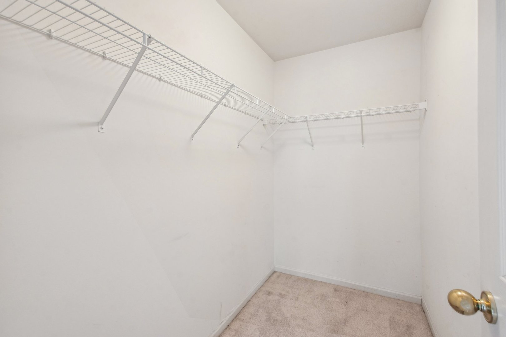 2673 Rourke Drive Aurora, IL 60503 - Photo 18 of 37 a view of a room with racks on the wall