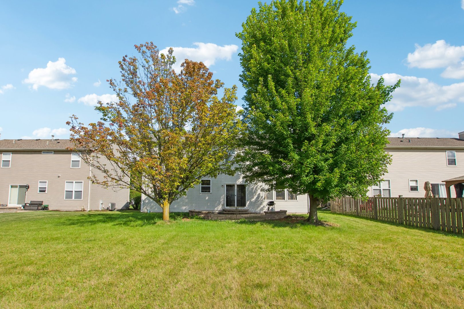 2673 Rourke Drive Aurora, IL 60503 - Photo 32 of 37 a front view of a house with a garden