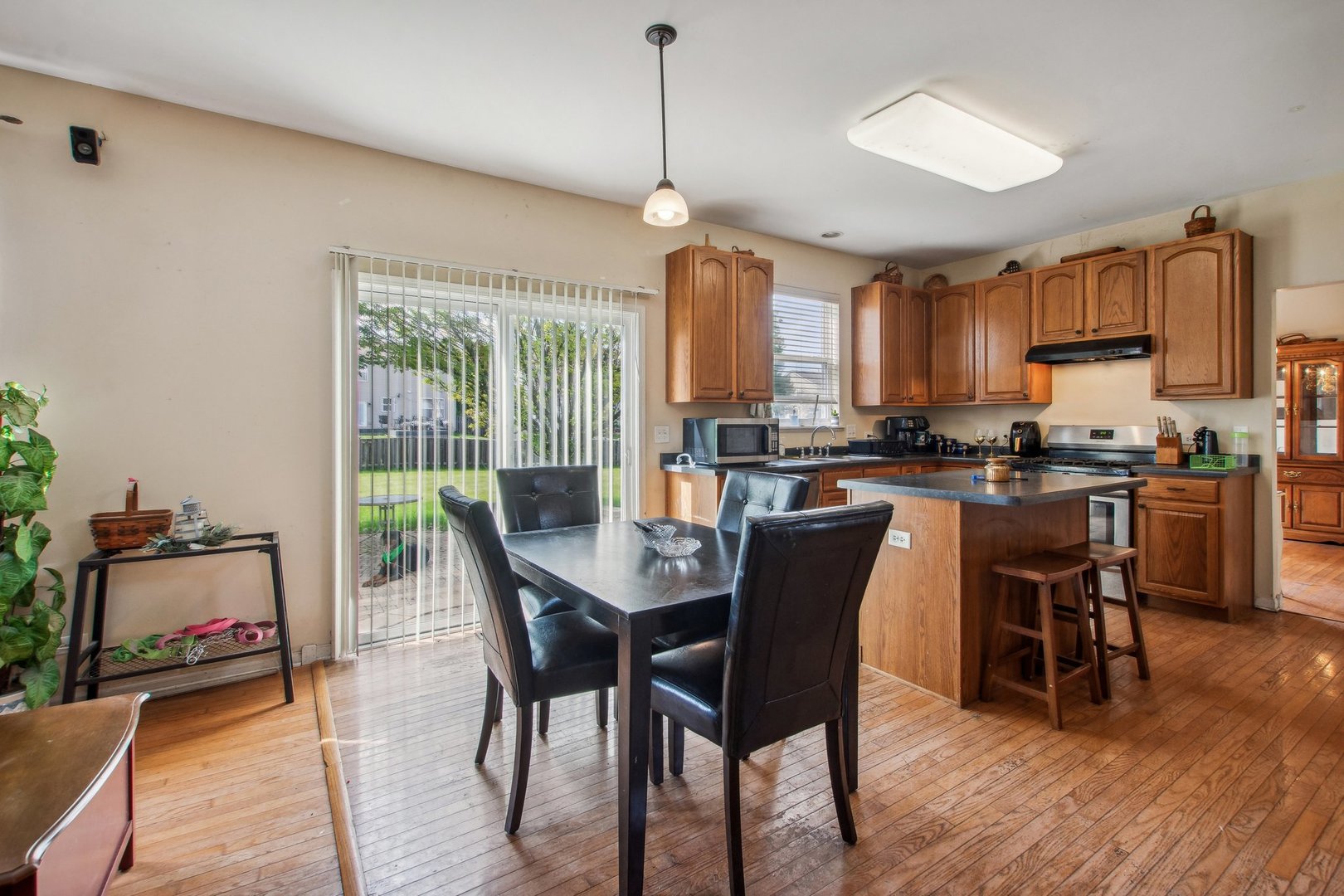 2673 Rourke Drive Aurora, IL 60503 - Photo 4 of 37 a dining room with furniture window and wooden floor