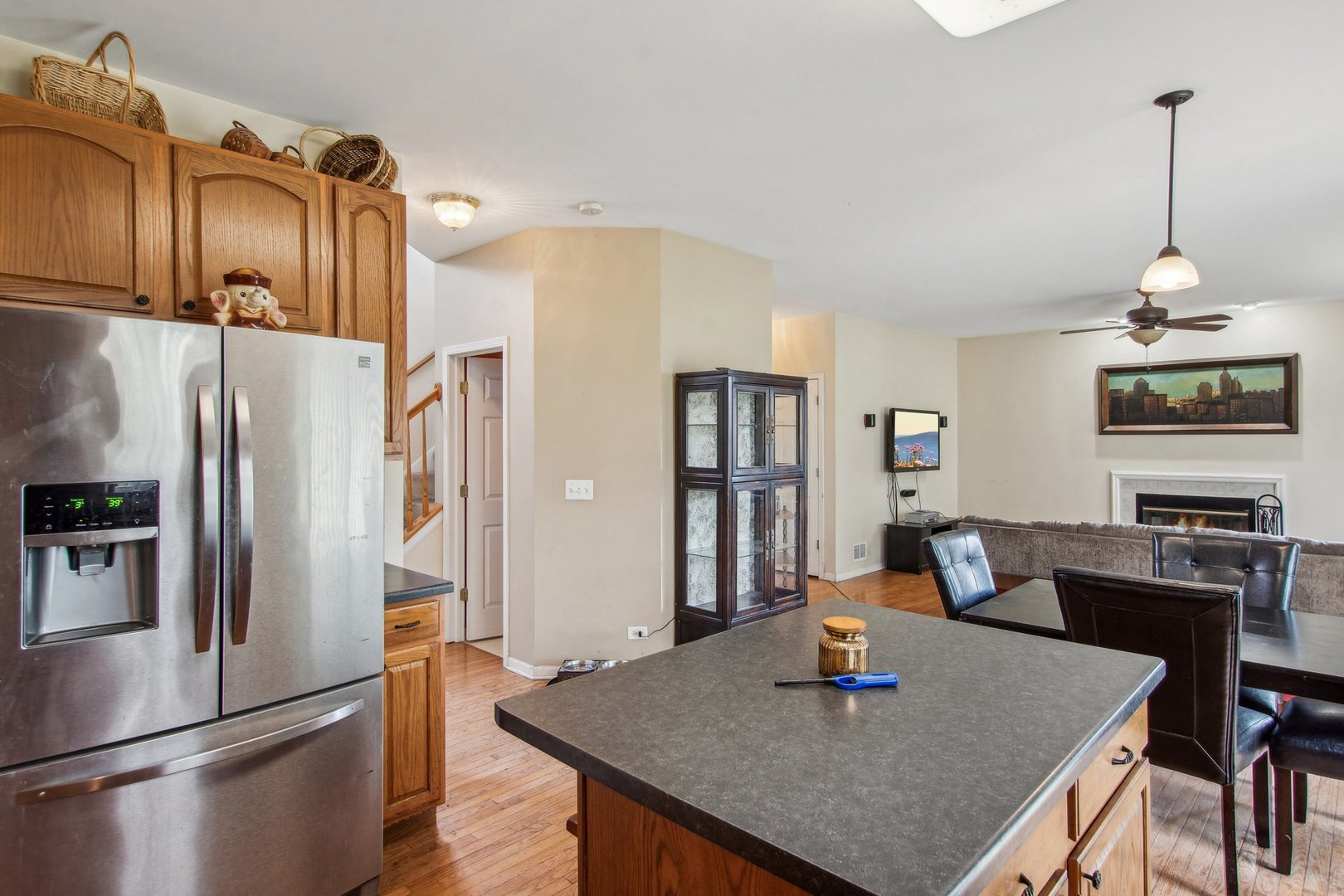 2673 Rourke Drive Aurora, IL 60503 - Photo 7 of 37 a dining room with stainless steel appliances granite countertop a table chairs and refrigerator