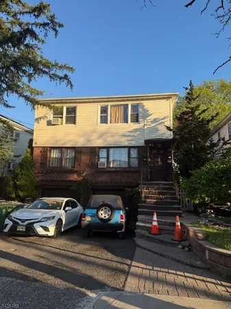 a car parked in front of a house