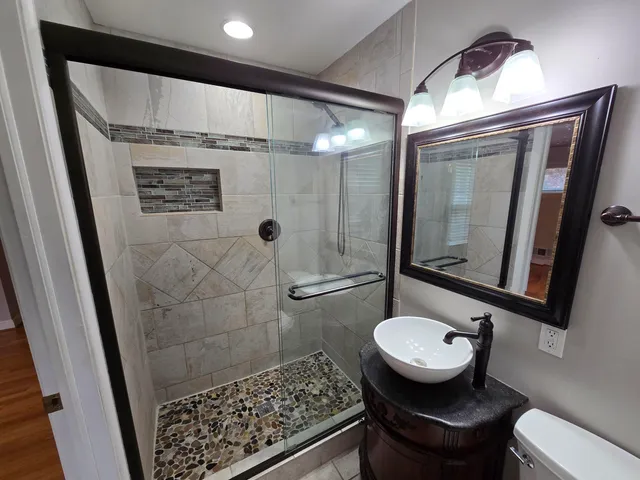 a bathroom with a sink and a mirror