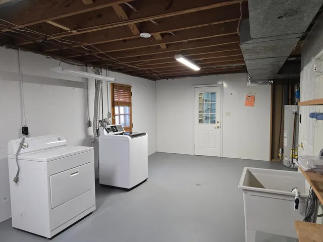 a view of storage and utility room with washer and dryer