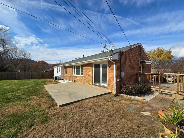 a view of a house next to a yard