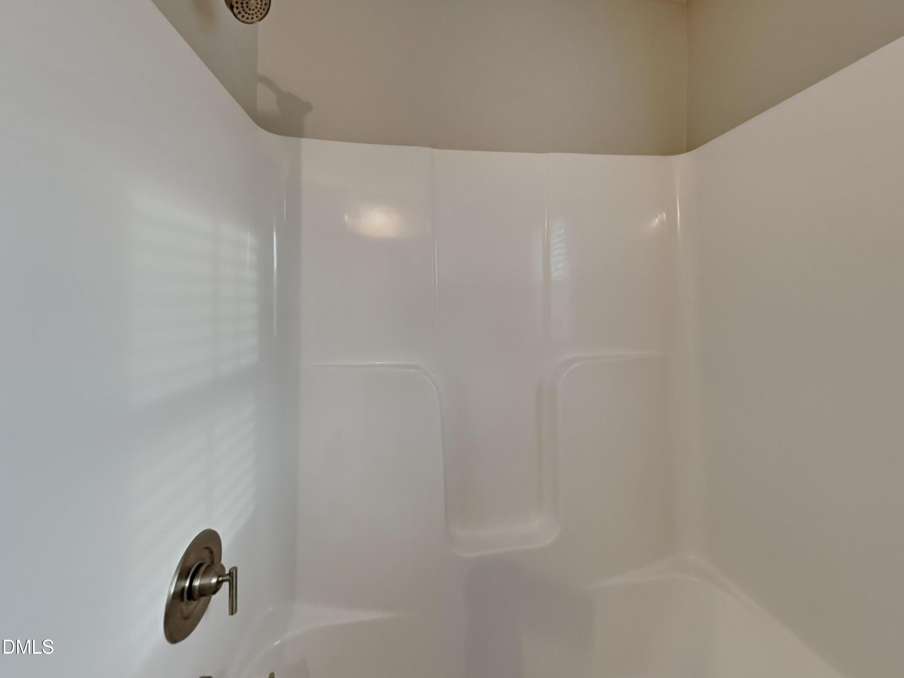 803 Springtooth Drive Zebulon, NC 27597 - Photo 15 of 16 a bathroom with a shower