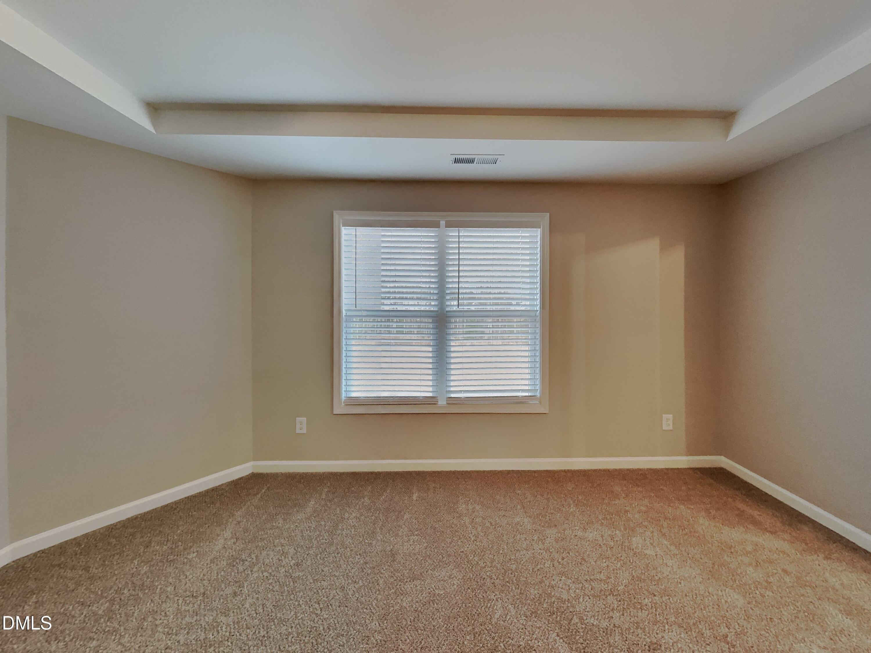 803 Springtooth Drive Zebulon, NC 27597 - Photo 6 of 16 an empty room with a window
