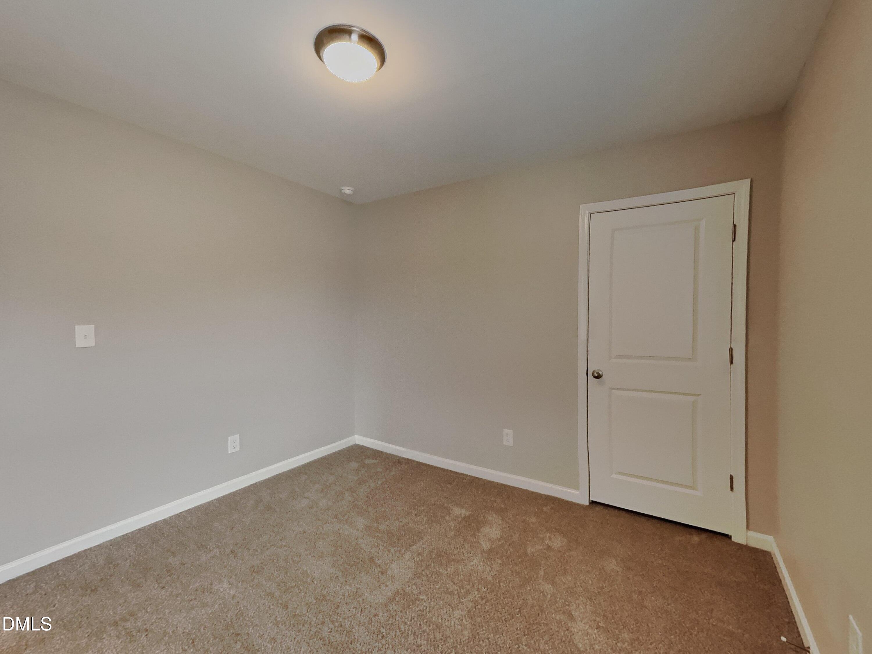 803 Springtooth Drive Zebulon, NC 27597 - Photo 9 of 16 a view of an empty room