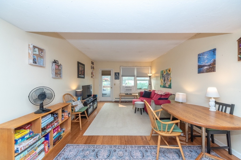 40 Nashua Street, Unit 5 Clinton, MA 01510 - Photo 17 of 33 a living room with furniture a rug and a table
