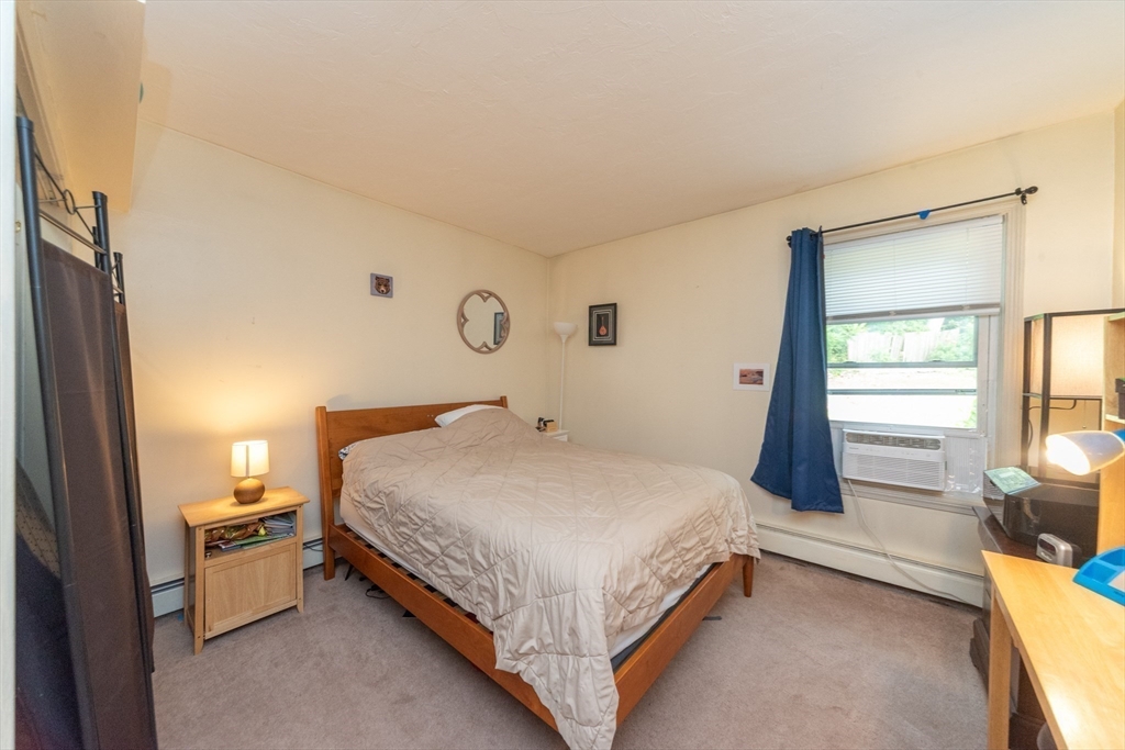 40 Nashua Street, Unit 5 Clinton, MA 01510 - Photo 19 of 33 a bed room with a bed and a window