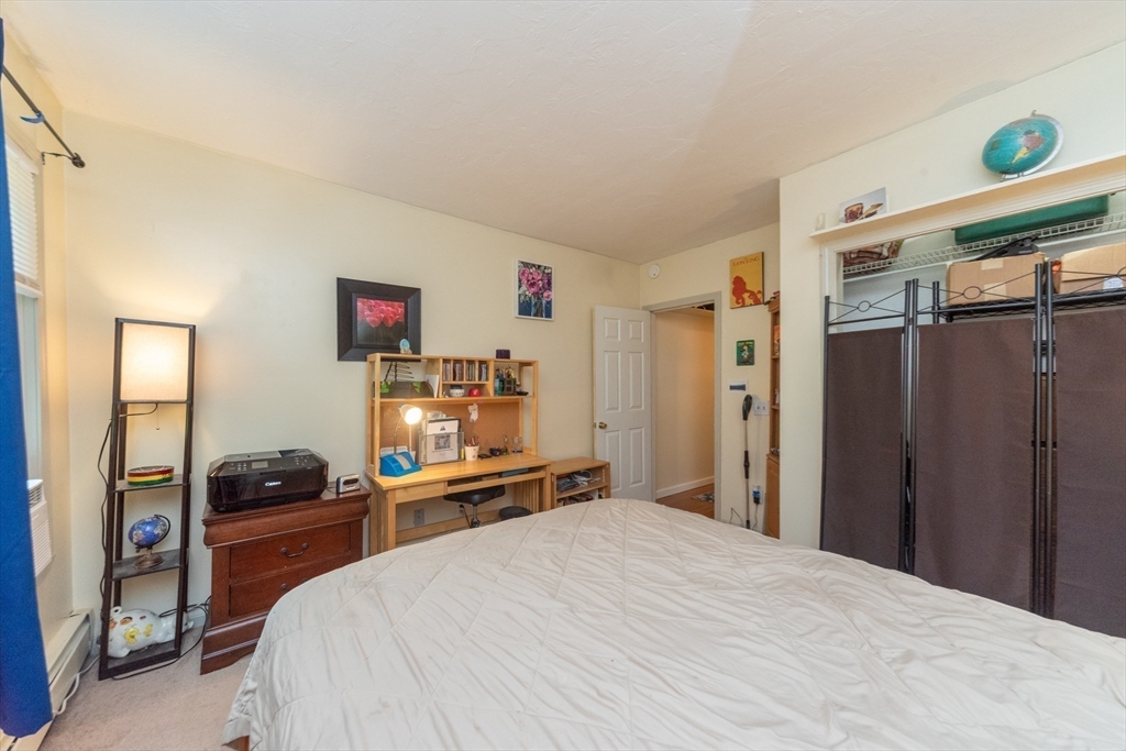 40 Nashua Street, Unit 5 Clinton, MA 01510 - Photo 20 of 33 a bedroom with a bed and a window