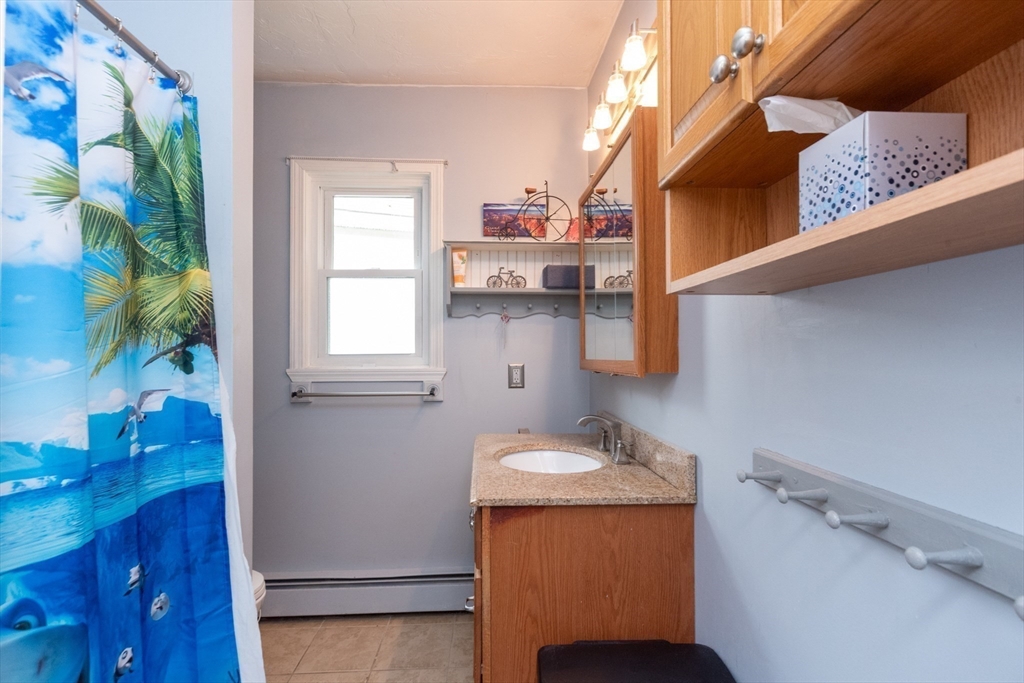40 Nashua Street, Unit 5 Clinton, MA 01510 - Photo 22 of 33 a bathroom with a sink and a mirror