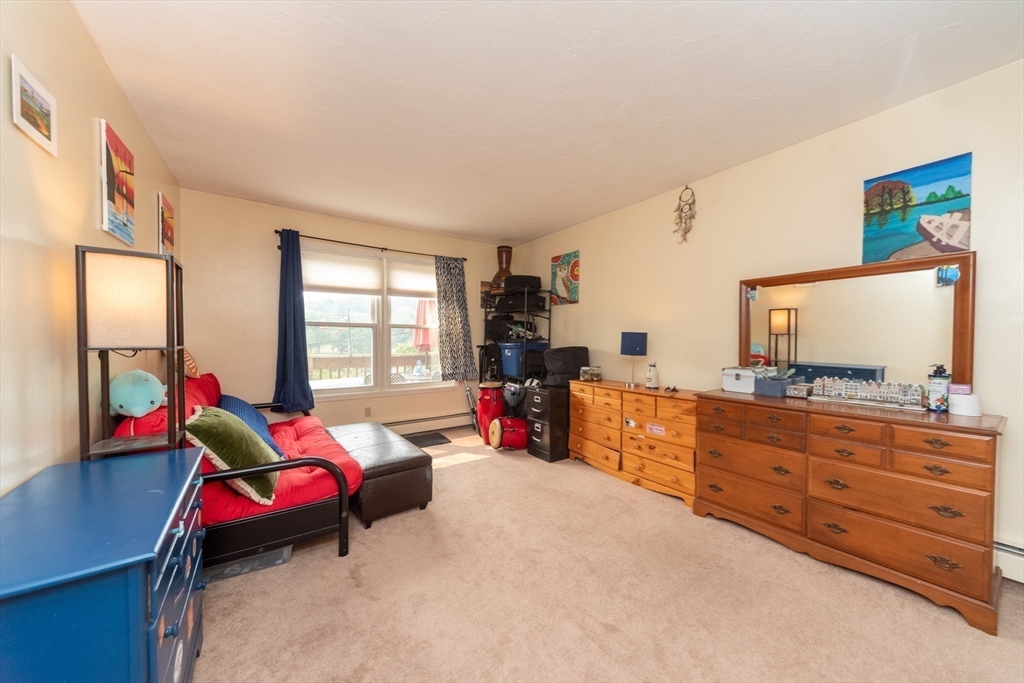 40 Nashua Street, Unit 5 Clinton, MA 01510 - Photo 23 of 33 a living room with furniture and a flat screen tv