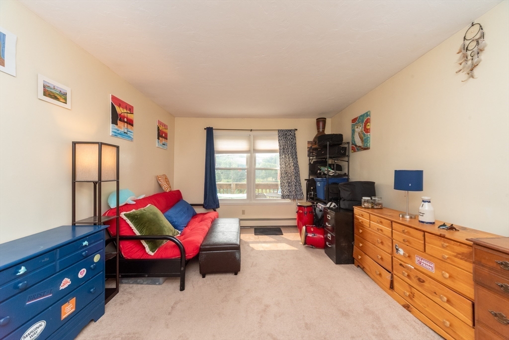 40 Nashua Street, Unit 5 Clinton, MA 01510 - Photo 24 of 33 a living room with furniture a flat screen tv and a window