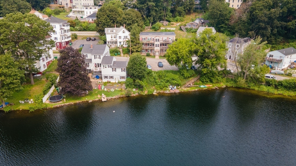 40 Nashua Street, Unit 5 Clinton, MA 01510 - Photo 31 of 33 an aerial view of residential houses with outdoor space and a lake view