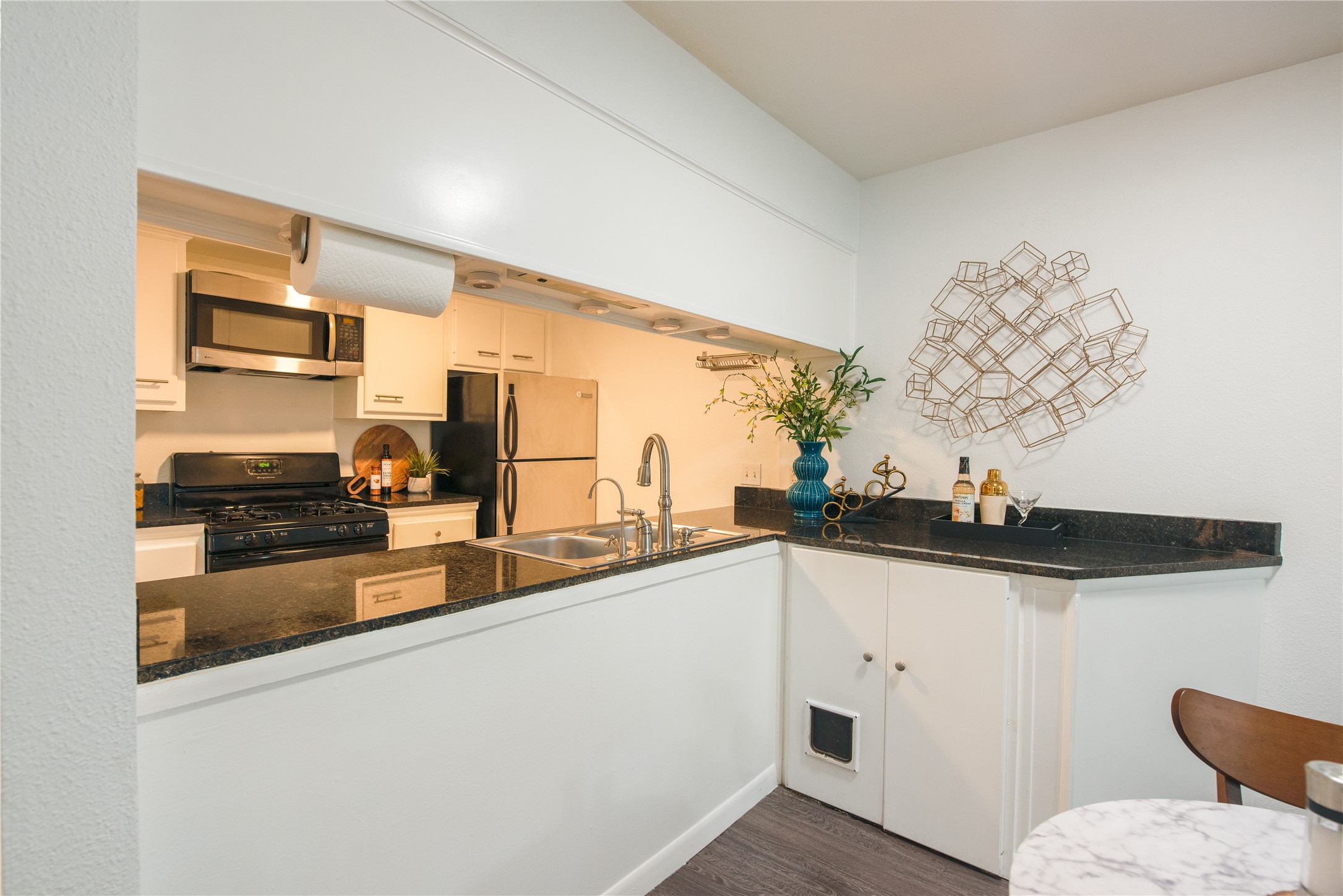 4209 Burnet Road, Unit 106 Austin, TX 78756 - Photo 12 of 17 a kitchen with stainless steel appliances a sink and a stove