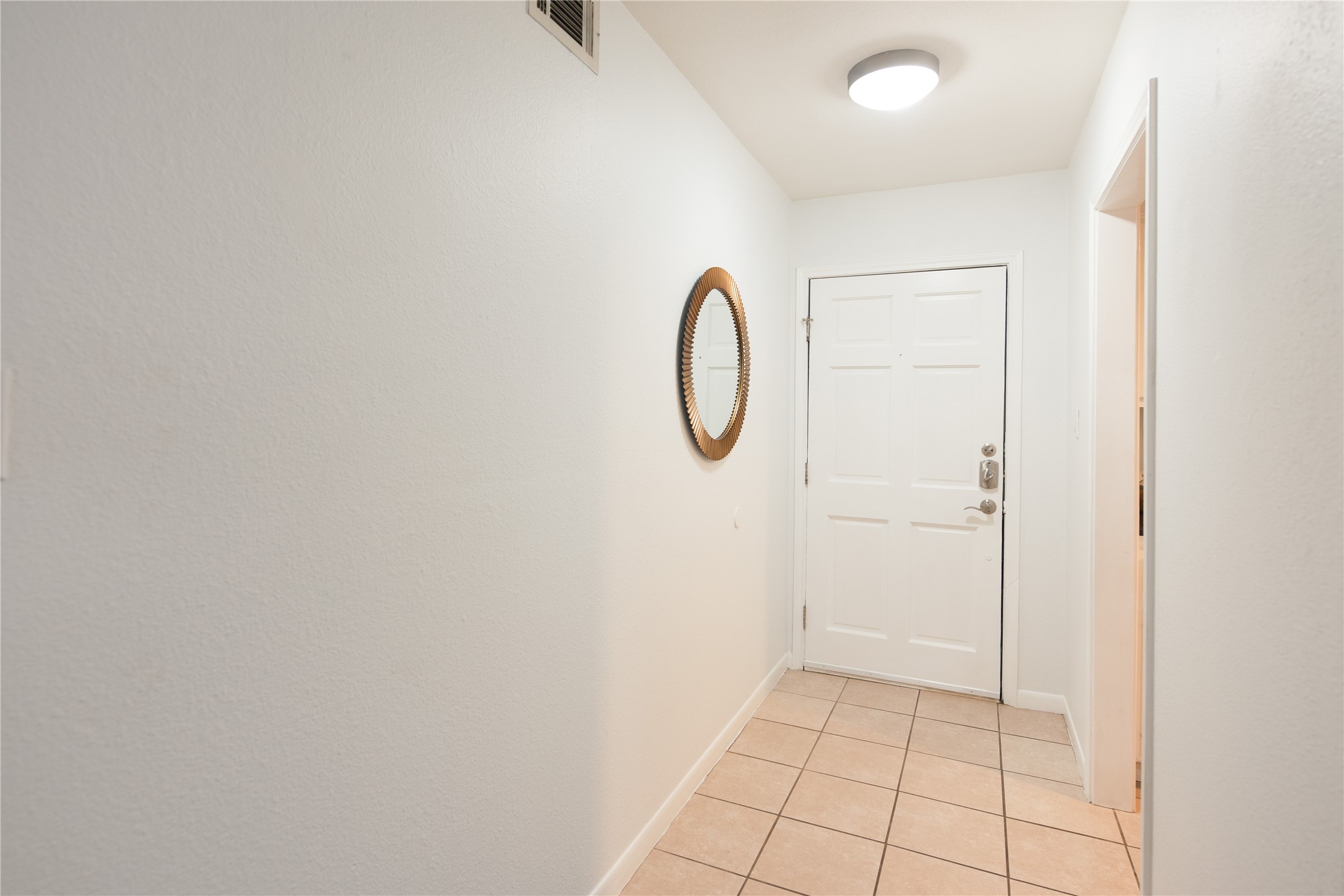 4209 Burnet Road, Unit 106 Austin, TX 78756 - Photo 15 of 17 a view of a room with white walls and tiles