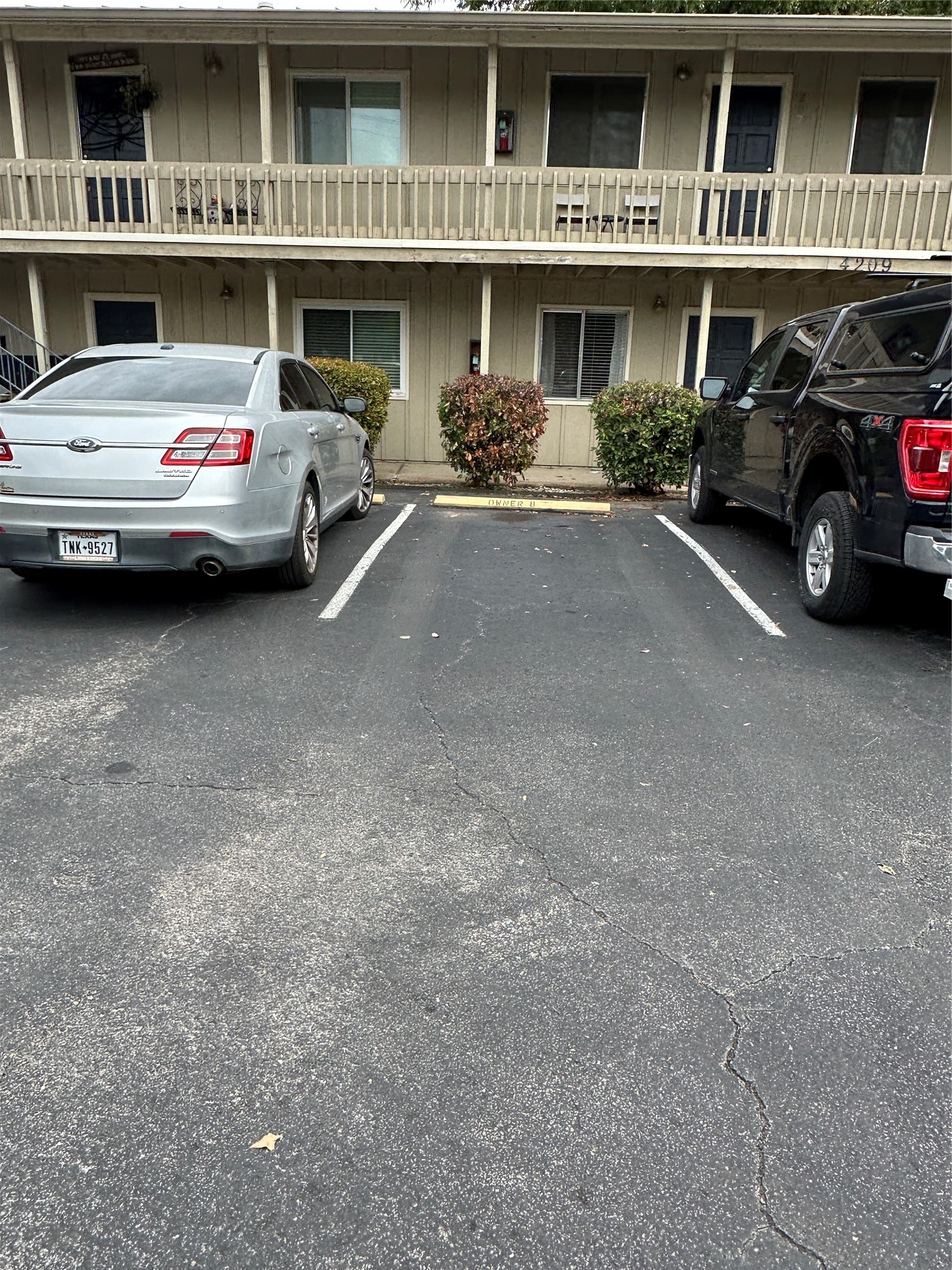 4209 Burnet Road, Unit 106 Austin, TX 78756 - Photo 17 of 17 a view of a street that has couple of cars parked in front of it