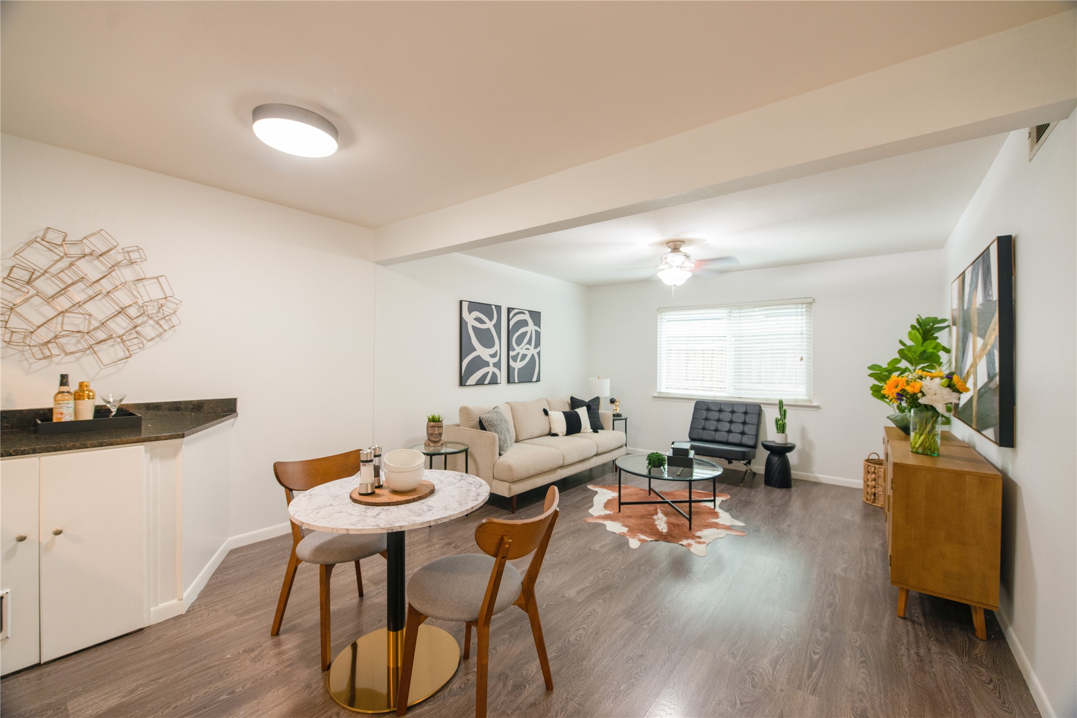 4209 Burnet Road, Unit 106 Austin, TX 78756 - Photo 2 of 17 a living room with furniture and wooden floor
