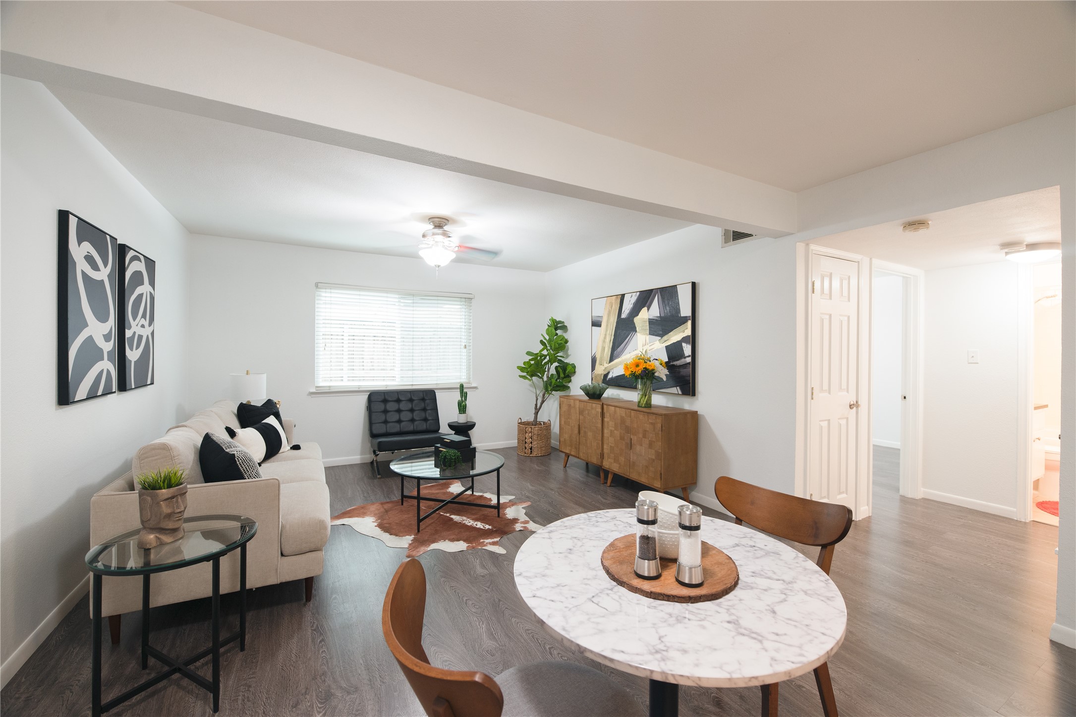 4209 Burnet Road, Unit 106 Austin, TX 78756 - Photo 7 of 17 a living room with furniture and a wooden floor