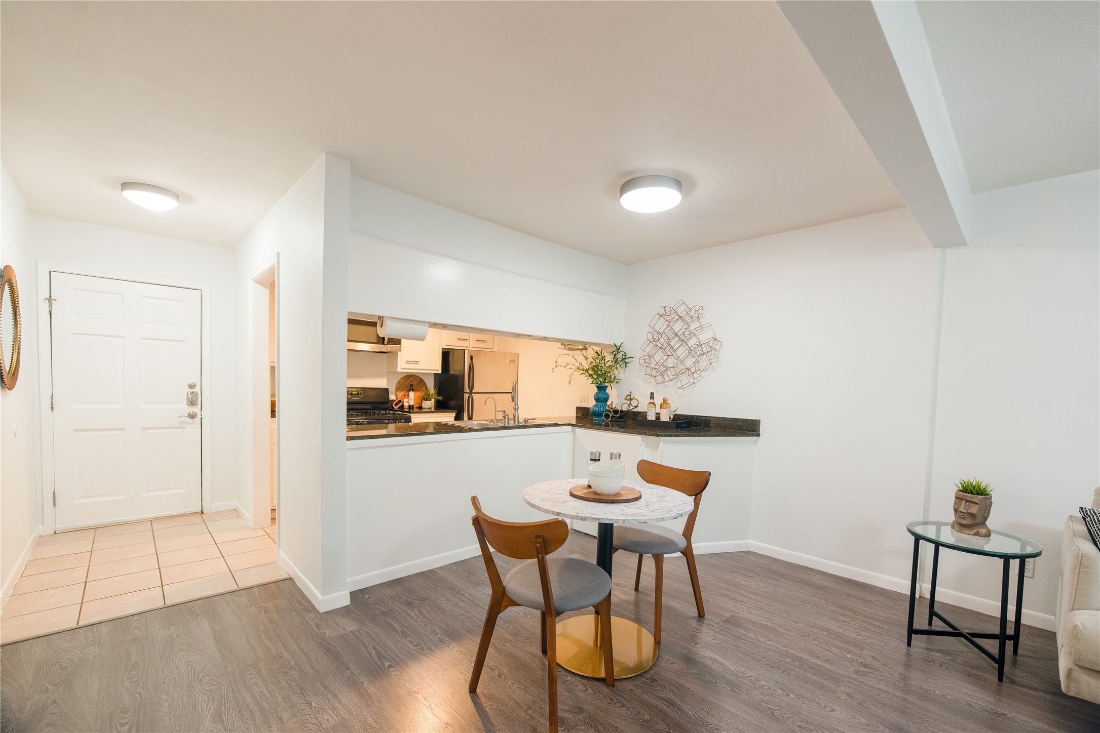4209 Burnet Road, Unit 106 Austin, TX 78756 - Photo 9 of 17 a dining room with furniture and wooden floor