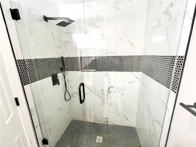 a bathroom with a sink mirror vanity and toilet