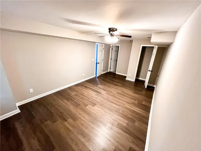 a view of a white house with a large window