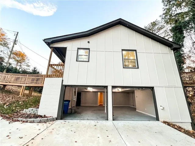 a view of a house with a small yard next to a house