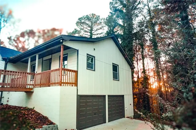 a front view of a house with garage