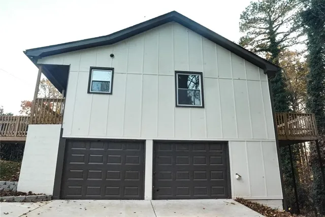 a view of a house with a small car