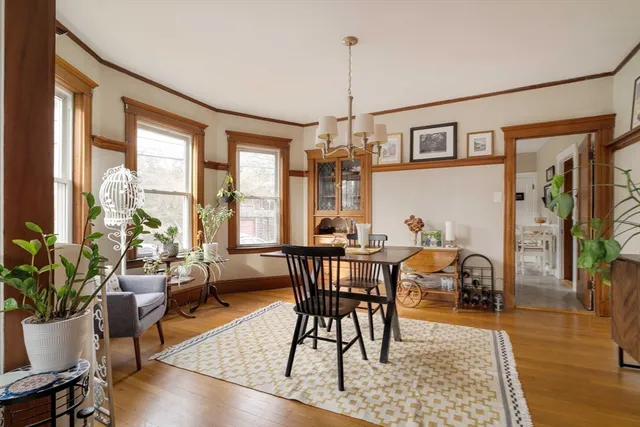a view of a livingroom with furniture window and wooden floor