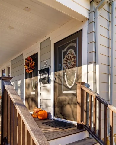 a view of a workspace with wooden floor and furniture