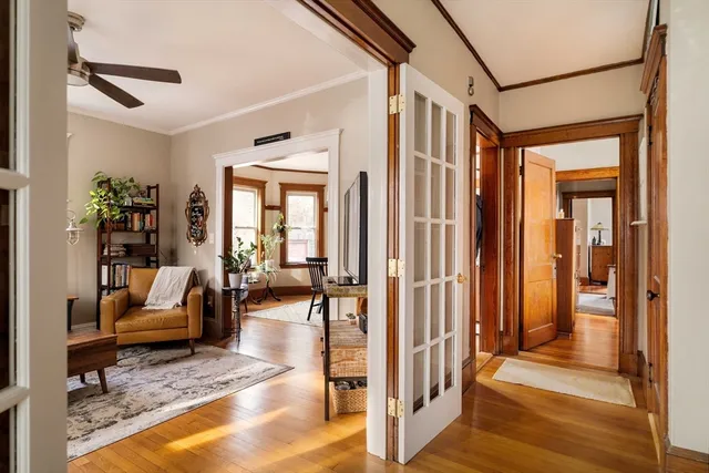 a view of a hallway with a living room