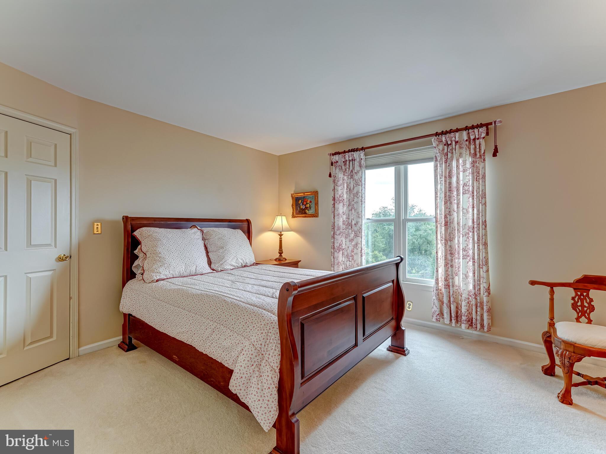 216 Line Road Malvern, PA 19355 - Photo 22 of 38 a bed sitting in a bedroom next to a window