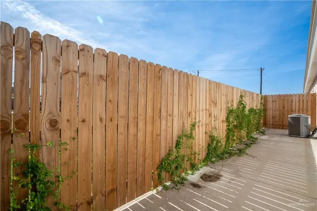 a view of a backyard with potted plants