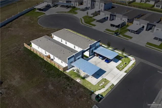 an aerial view of house with yard