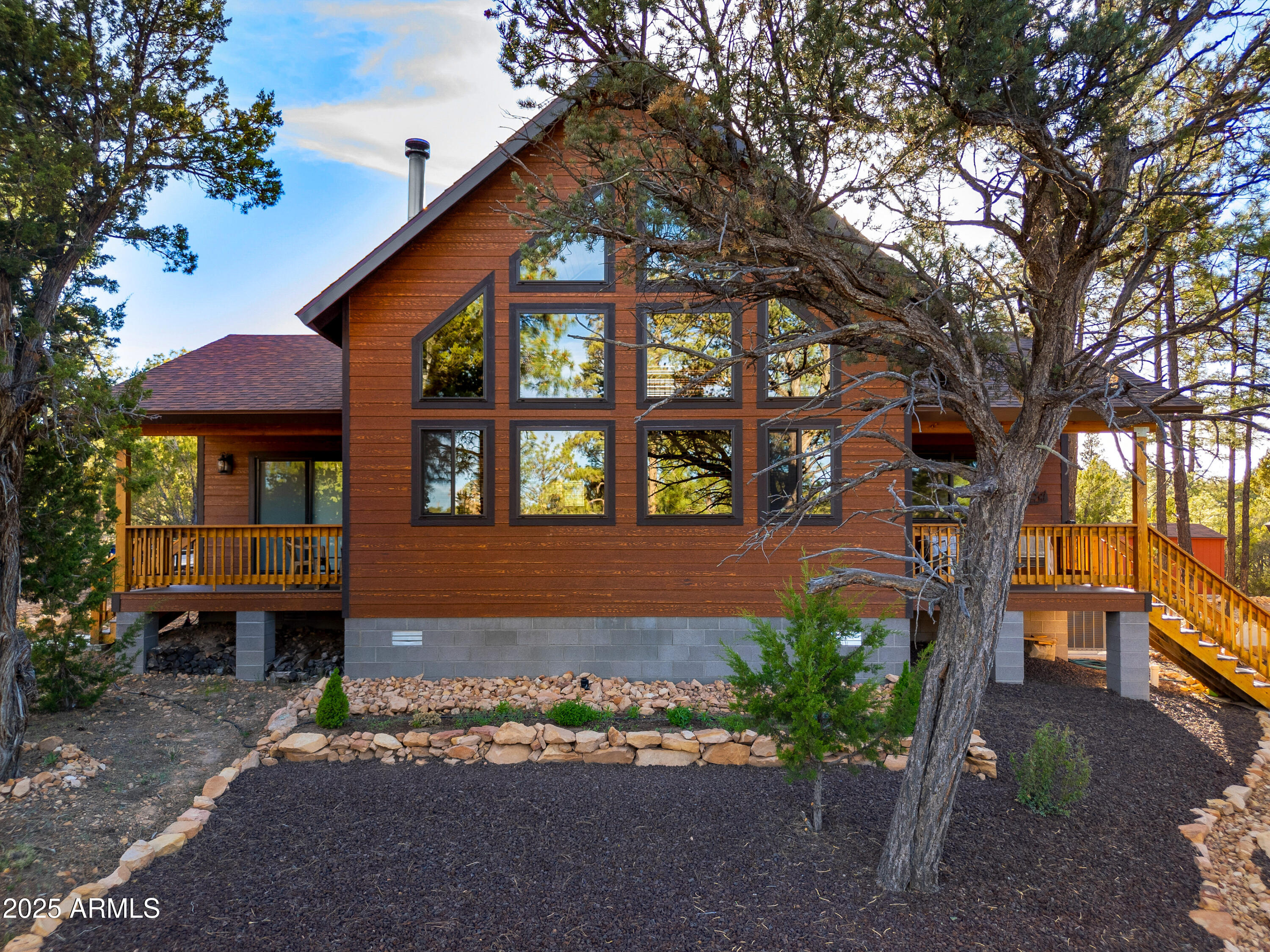 3334 Sawmill Ridge Loop Heber, AZ 85928 - Photo 6 of 58 a front view of a house with garden
