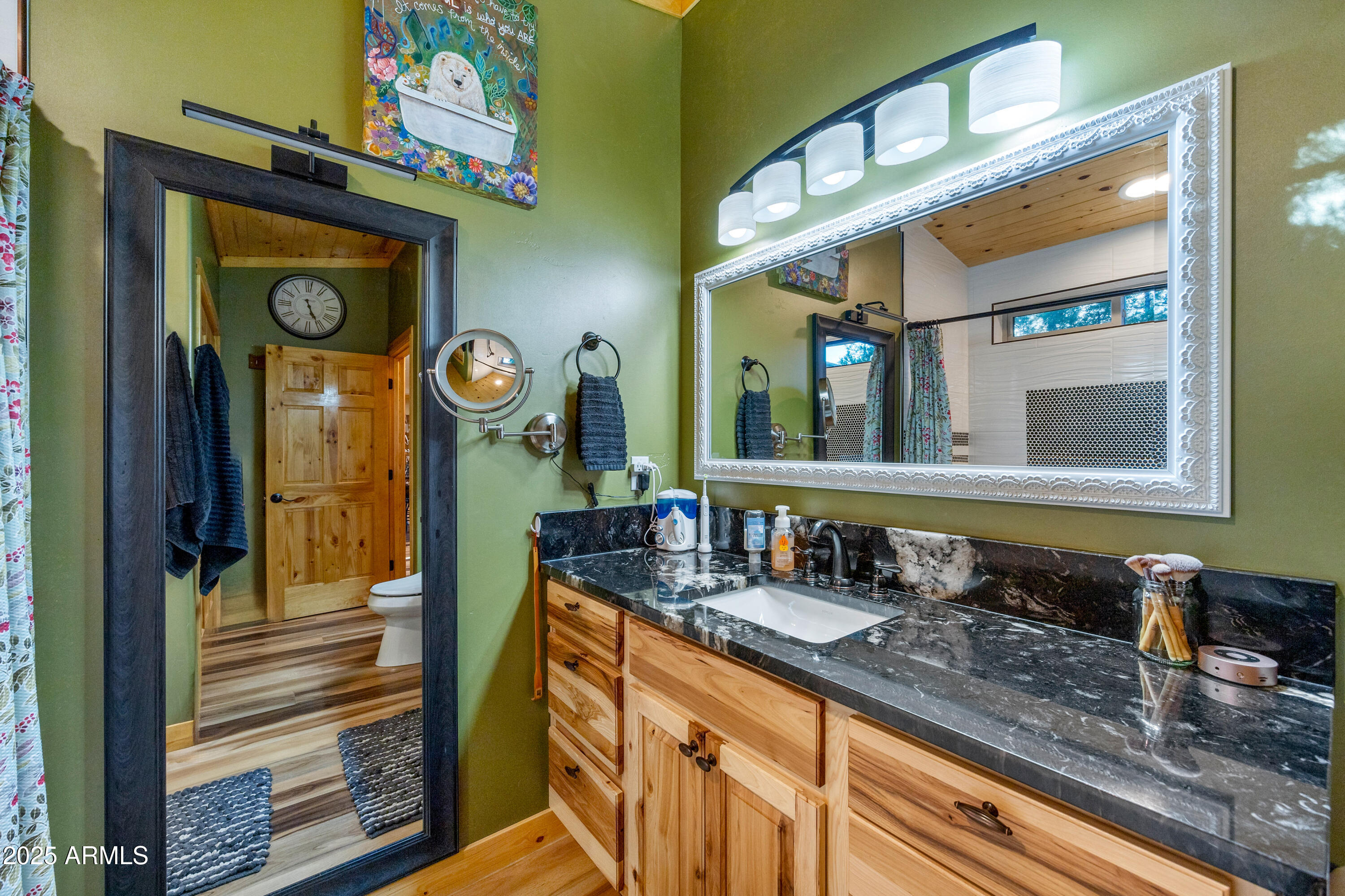 3334 Sawmill Ridge Loop Heber, AZ 85928 - Photo 22 of 58 a bathroom with a sink and a mirror