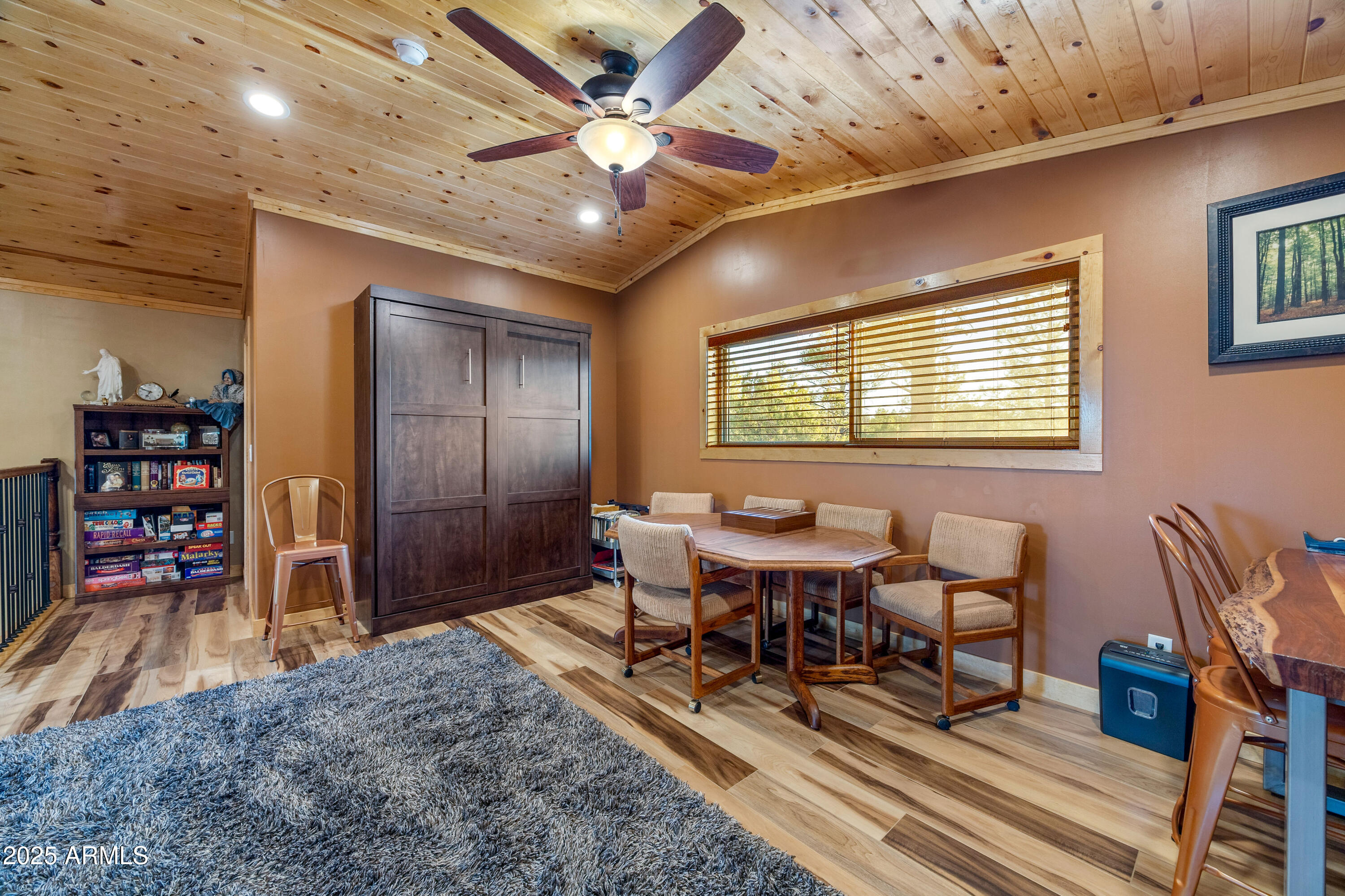 3334 Sawmill Ridge Loop Heber, AZ 85928 - Photo 24 of 58 a view of a dining room with furniture window and wooden floor