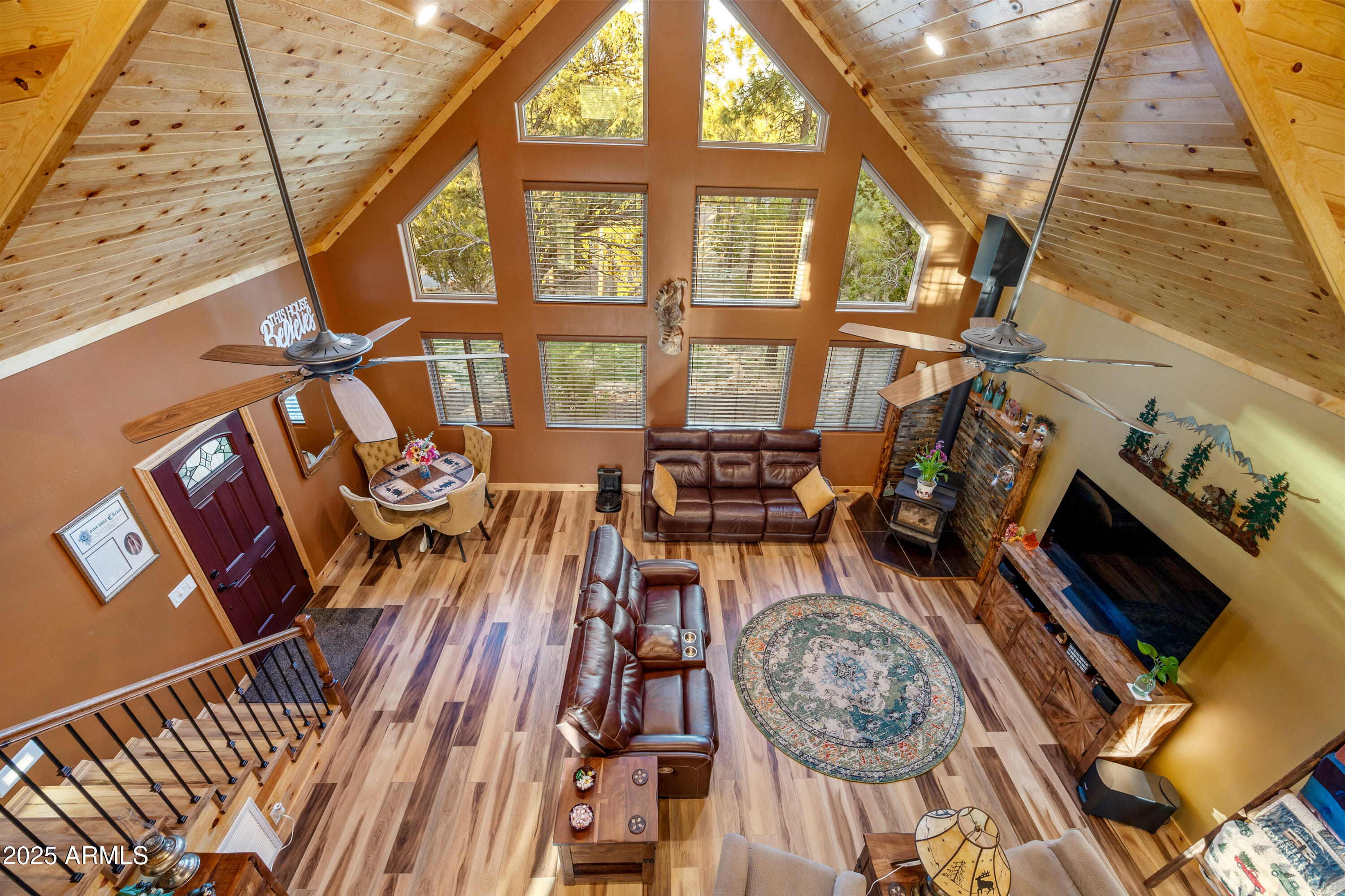 3334 Sawmill Ridge Loop Heber, AZ 85928 - Photo 25 of 58 a view of a living room and a wooden floor