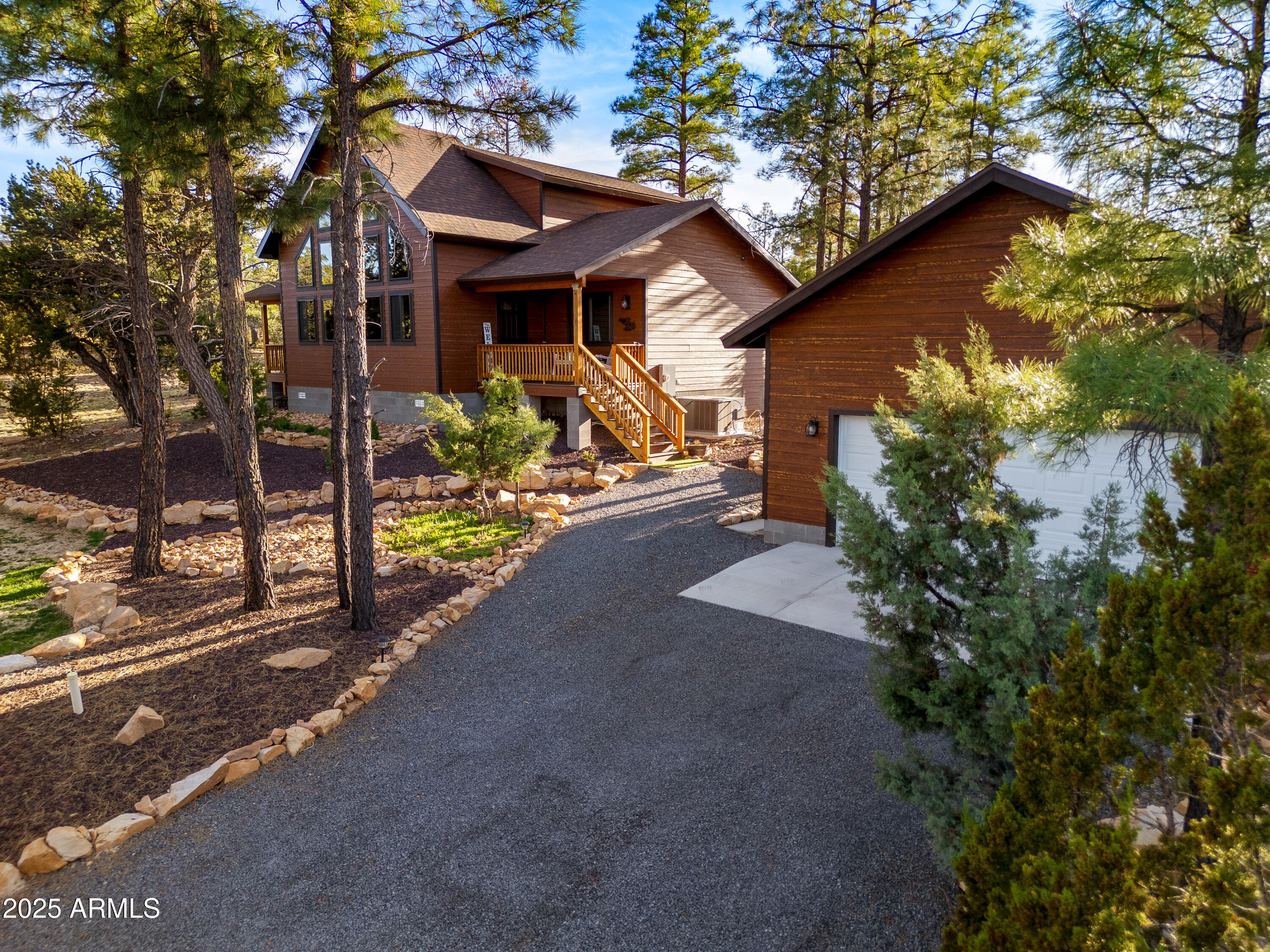 3334 Sawmill Ridge Loop Heber, AZ 85928 - Photo 4 of 58 a front view of a house with garden