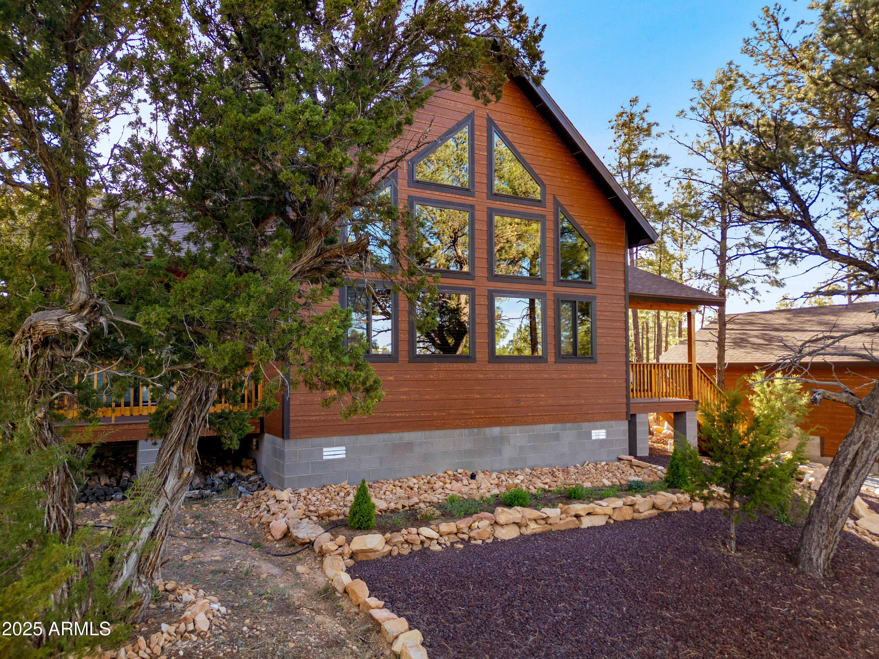 3334 Sawmill Ridge Loop Heber, AZ 85928 - Photo 5 of 58 a front view of a house with garden