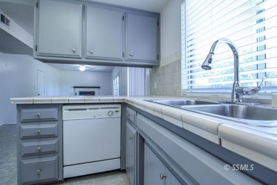 432 Debra Lane Ridgecrest, CA 93555 - Photo 16 of 39 a kitchen with appliances cabinets and a sink