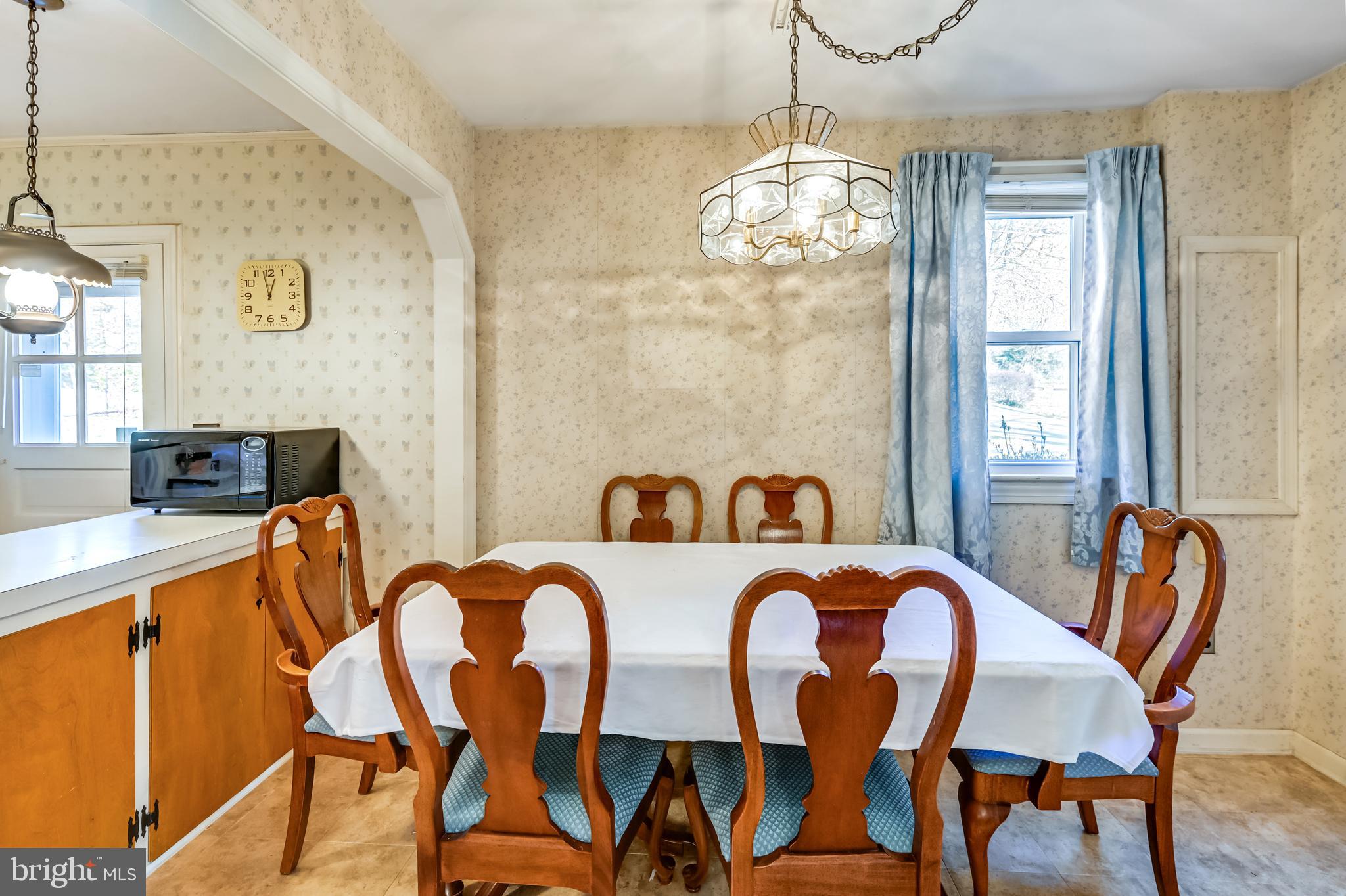 11418 Mapleview Drive Silver Spring, MD 20902 - Photo 6 of 44 a view of a dining room with furniture and chandelier